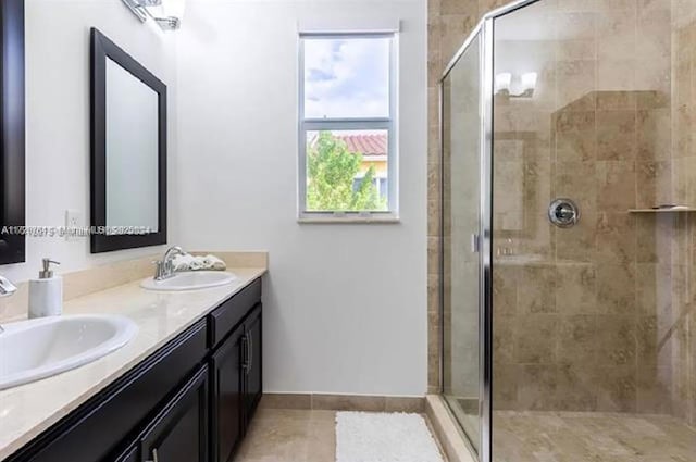 bathroom featuring an enclosed shower and vanity