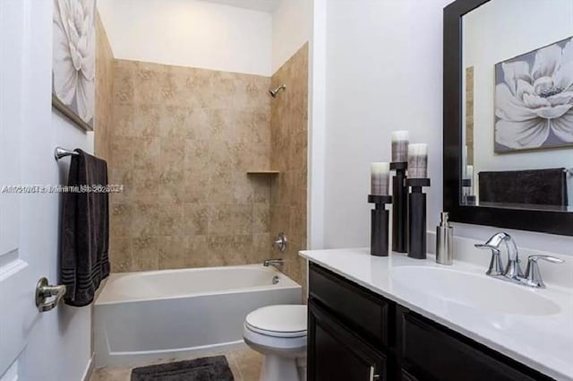 full bathroom with toilet, tiled shower / bath, and vanity