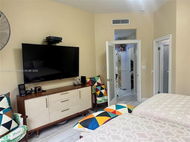 bedroom with light hardwood / wood-style floors