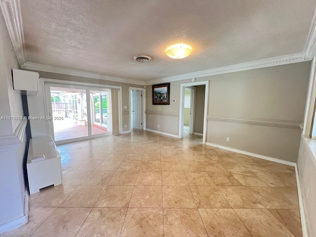 spare room featuring a textured ceiling, light tile patterned floors, and crown molding