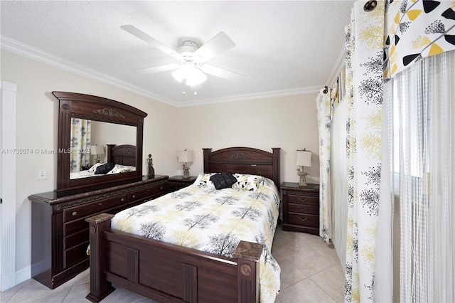 tiled bedroom with ceiling fan, ornamental molding, and a textured ceiling