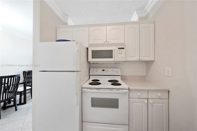 kitchen featuring white cabinetry, white appliances, a textured ceiling, and light tile patterned flooring