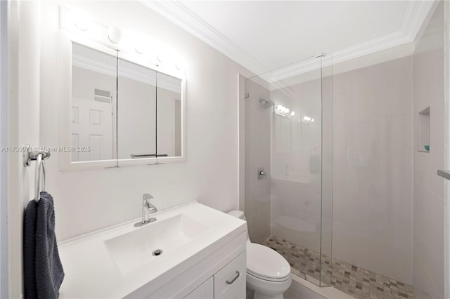 bathroom with ornamental molding, toilet, an enclosed shower, and vanity