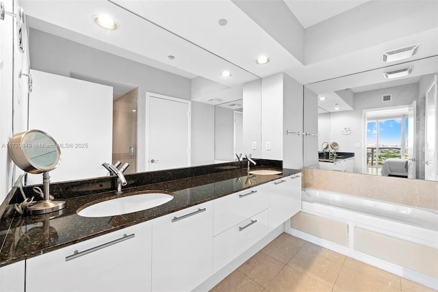 bathroom featuring tile patterned floors and vanity