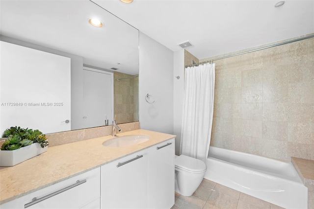 full bathroom with vanity, toilet, tile patterned floors, and shower / bath combo