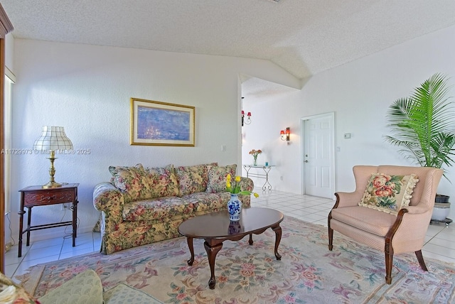 living room featuring light tile patterned floors, vaulted ceiling, and a textured ceiling