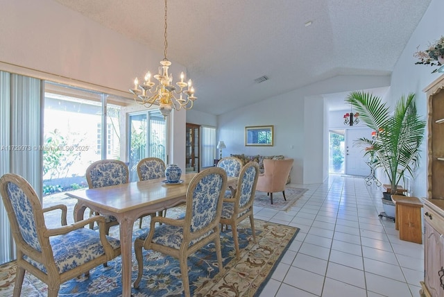 dining space featuring lofted ceiling, a chandelier, a textured ceiling, and light tile patterned floors