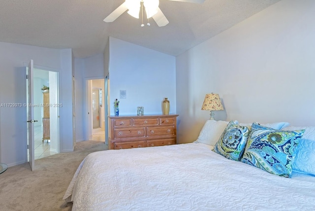 bedroom featuring lofted ceiling, light colored carpet, and ceiling fan