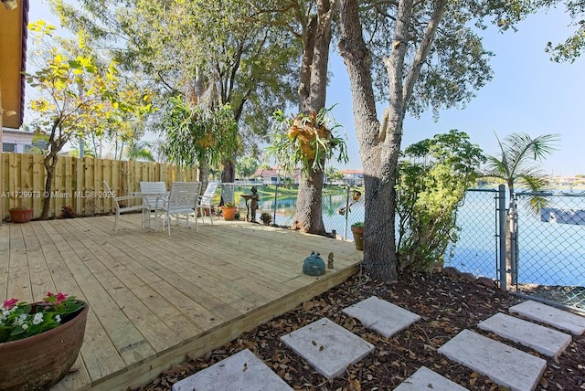 wooden deck with a water view