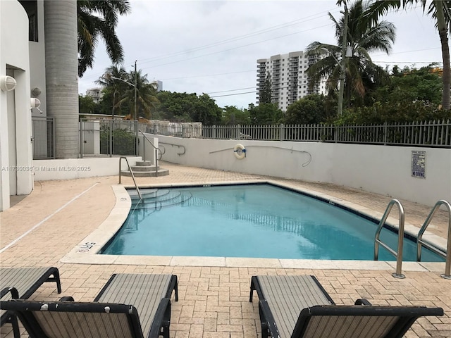 view of swimming pool featuring a patio