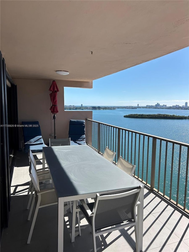 balcony featuring a water view