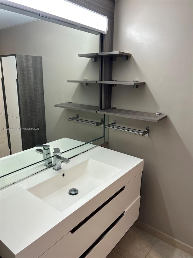 bathroom with tile patterned flooring and vanity