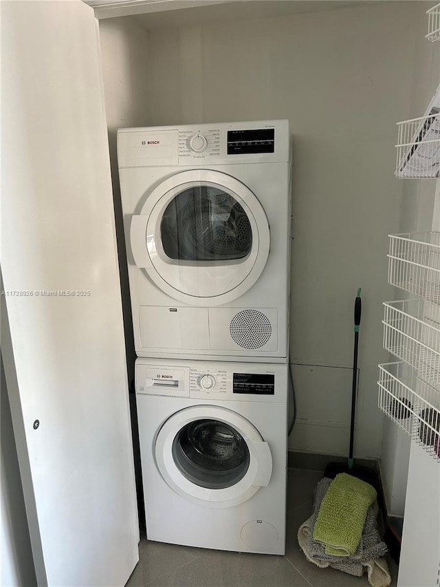 laundry room with stacked washer and dryer