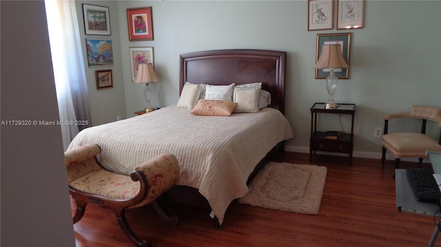 bedroom featuring dark hardwood / wood-style floors