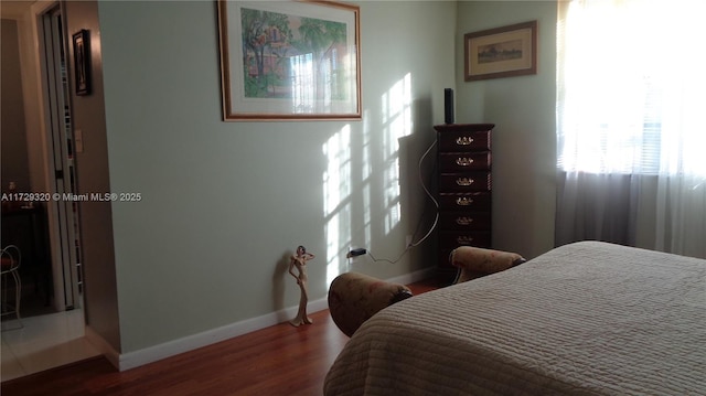 bedroom with hardwood / wood-style flooring