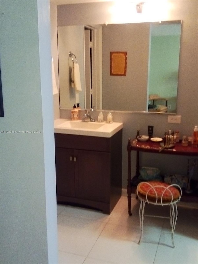 bathroom with vanity and tile patterned flooring