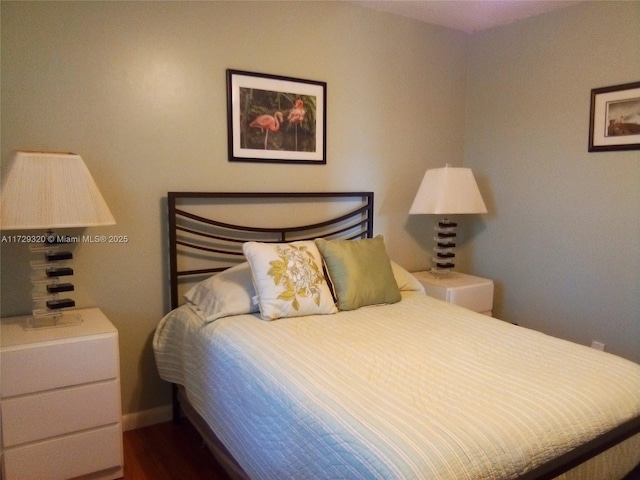 bedroom featuring dark wood-type flooring