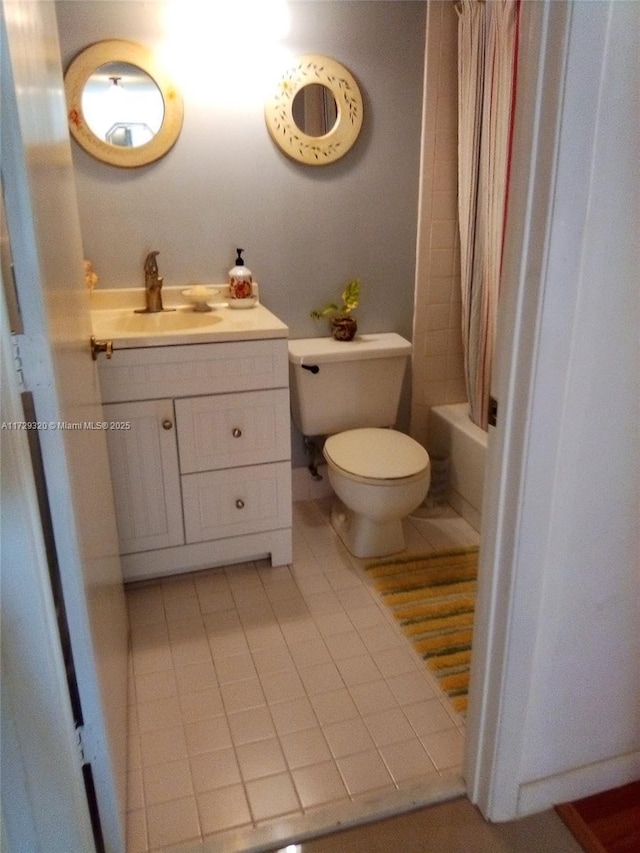 full bathroom with vanity, toilet, shower / bath combination with curtain, and tile patterned floors