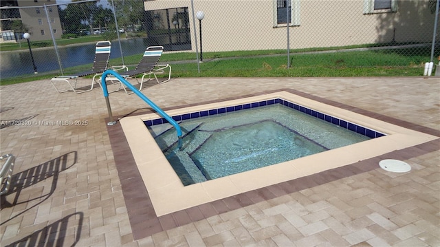 view of pool featuring a hot tub