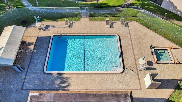 view of swimming pool featuring a patio