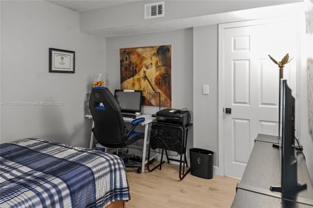 bedroom featuring light hardwood / wood-style flooring