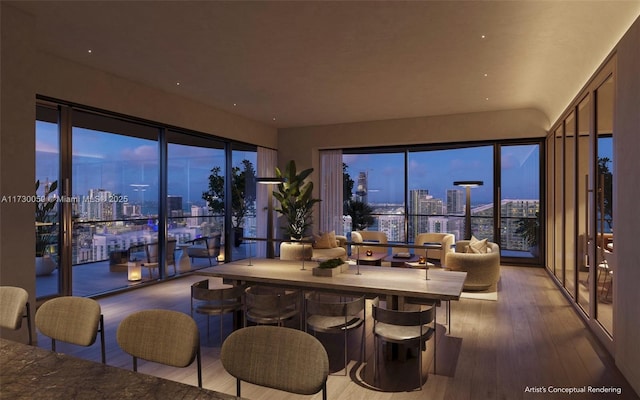 dining space with hardwood / wood-style flooring