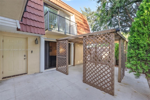 view of patio / terrace with a balcony