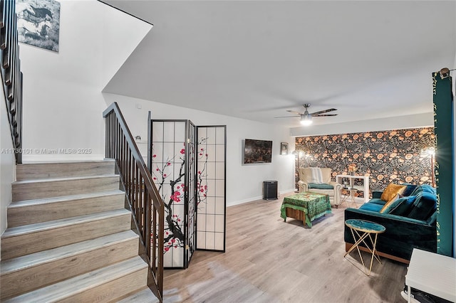 living room with hardwood / wood-style floors and ceiling fan