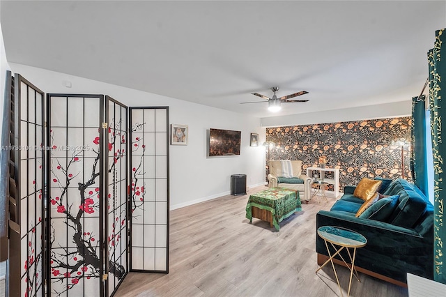 living room featuring hardwood / wood-style flooring and ceiling fan