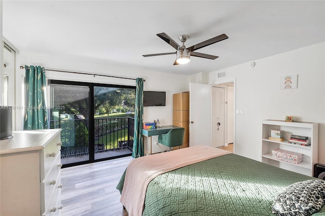 bedroom featuring light hardwood / wood-style flooring, ceiling fan, and access to outside