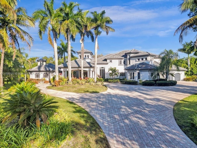 mediterranean / spanish house with a garage