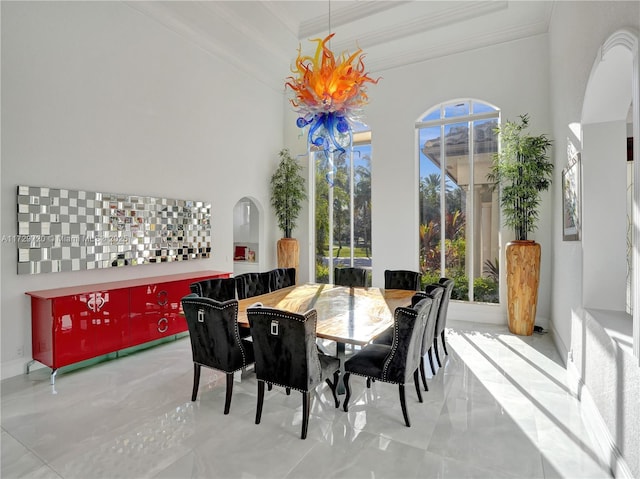 dining room featuring crown molding