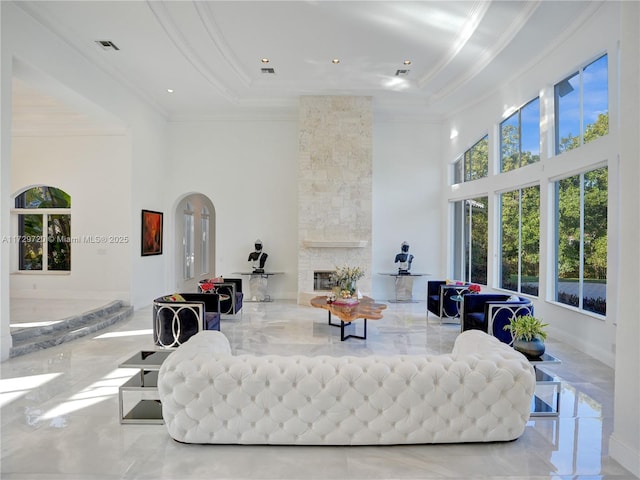 living room featuring crown molding and a tray ceiling