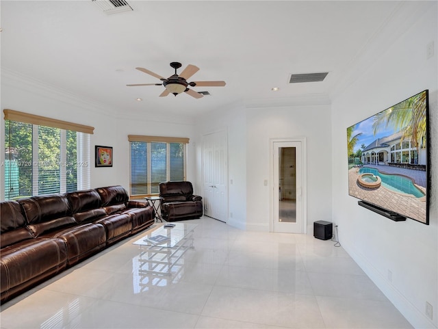 living room featuring crown molding, ceiling fan, and light tile patterned flooring