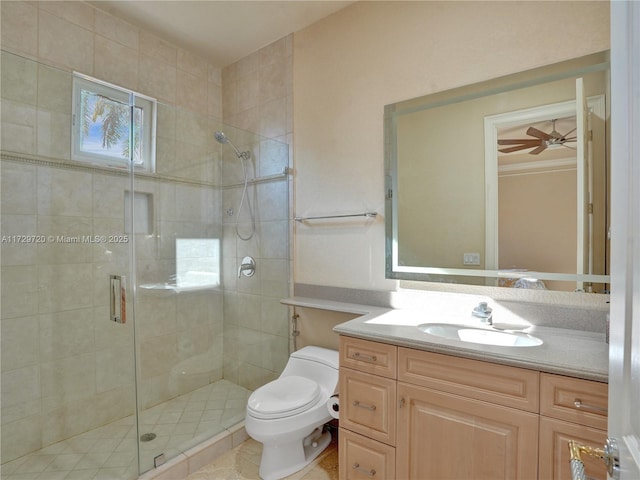 bathroom with vanity, ceiling fan, toilet, and walk in shower