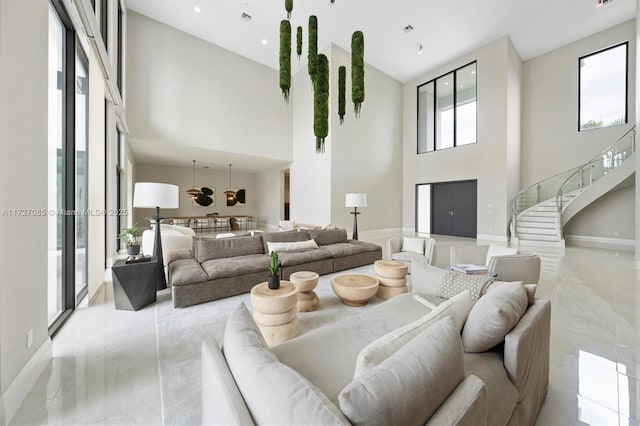 living room with a wealth of natural light and a high ceiling