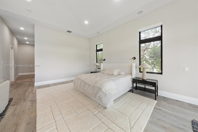 bedroom with light hardwood / wood-style flooring