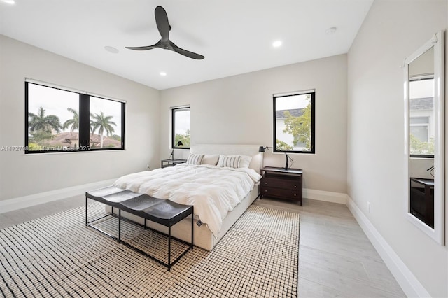 bedroom featuring ceiling fan and light hardwood / wood-style flooring