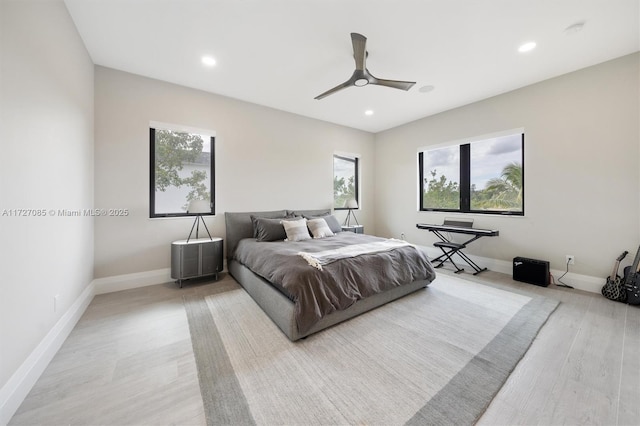 bedroom featuring light hardwood / wood-style floors and ceiling fan