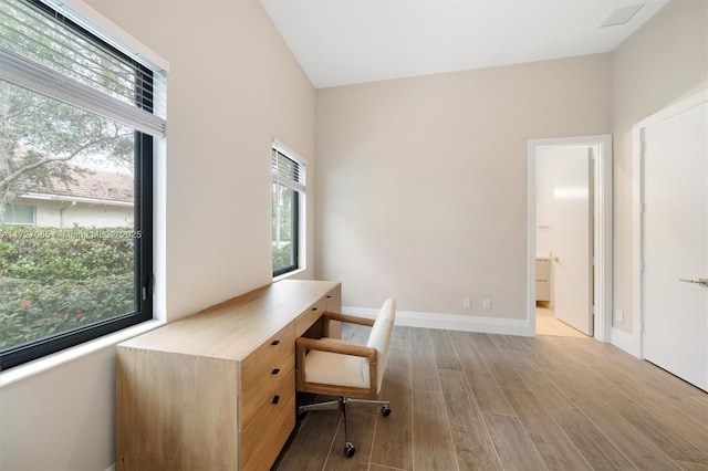 office space with light hardwood / wood-style flooring and plenty of natural light