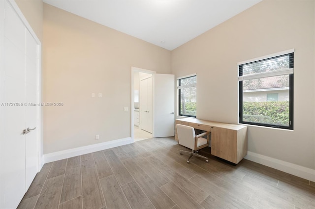 unfurnished office featuring light hardwood / wood-style flooring