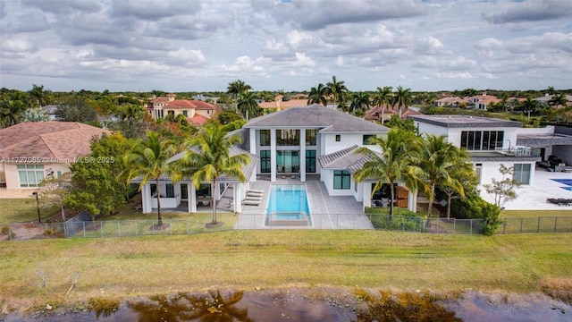 3275 Islewood Ave, Weston, FL 33332 - rear view of house featuring a fenced in pool, a yard, a residential view, and a fenced backyard