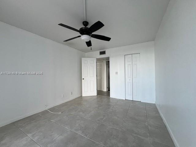 unfurnished bedroom with a closet and ceiling fan