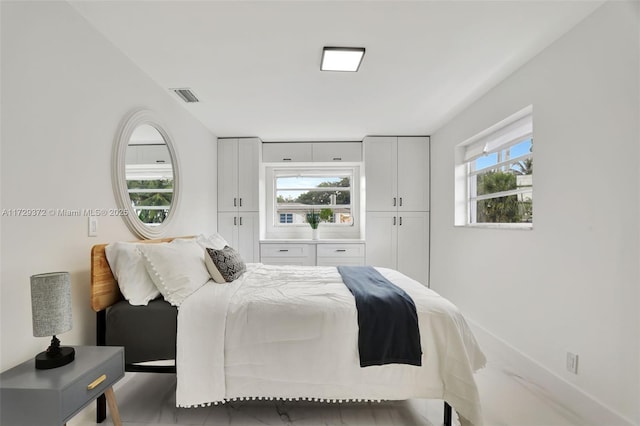 bedroom featuring multiple windows