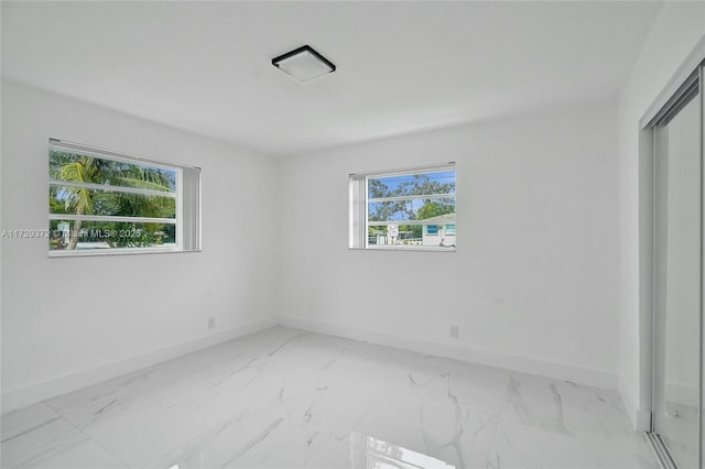 spare room featuring a wealth of natural light