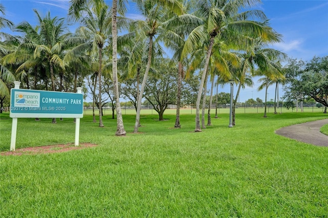 view of property's community with a yard