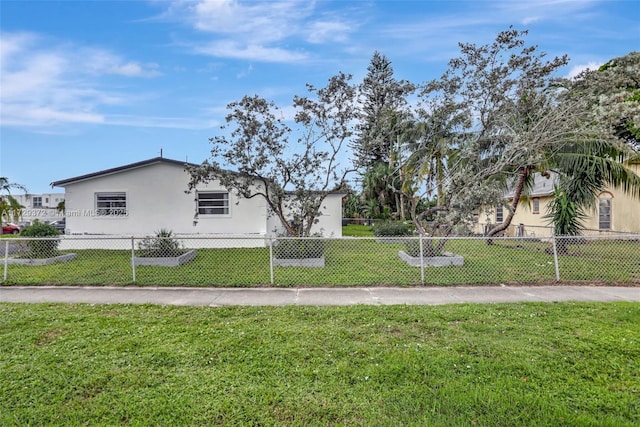 view of property exterior featuring a yard