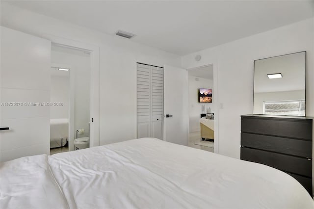 bedroom featuring ensuite bath