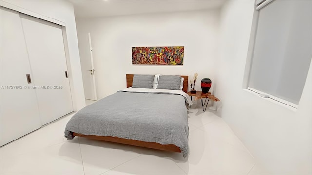 bedroom featuring a closet and tile patterned floors