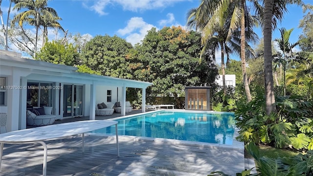 view of pool with a wooden deck
